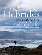 The cover of the book The Hebrides by Paul Murton depicts a single hiker standing on a rocky hill. The hiker overlooks islands and bodies of water under a cloudy sky. The subtext refers to BBC TV’s grand tours of the Scottish islands.