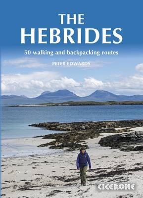 The book cover for *The Hebrides: 50 Walking and Backpacking Routes* by Peter Edwards depicts a person walking on a rocky beach. In the background, there are distant mountains and a blue sky. The title and author’s name are displayed prominently on the cover.