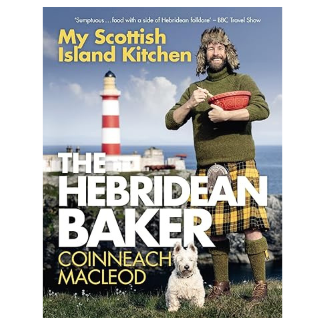 A man in a yellow tartan kilt and green sweater stands by a lighthouse, holding a red bowl and whisk, with a white dog at his feet. Text: The Hebridean Baker, by Coinneach Macleod.