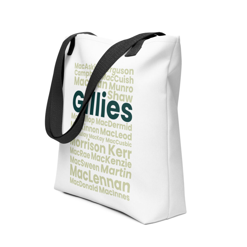 Certainly. Here is a factual description without ascribing feelings: The Tote bag features bold green Gillies text on the front with black straps. The surrounding area displays a vibrant pattern of Scottish surnames in lighter green and yellow hues.