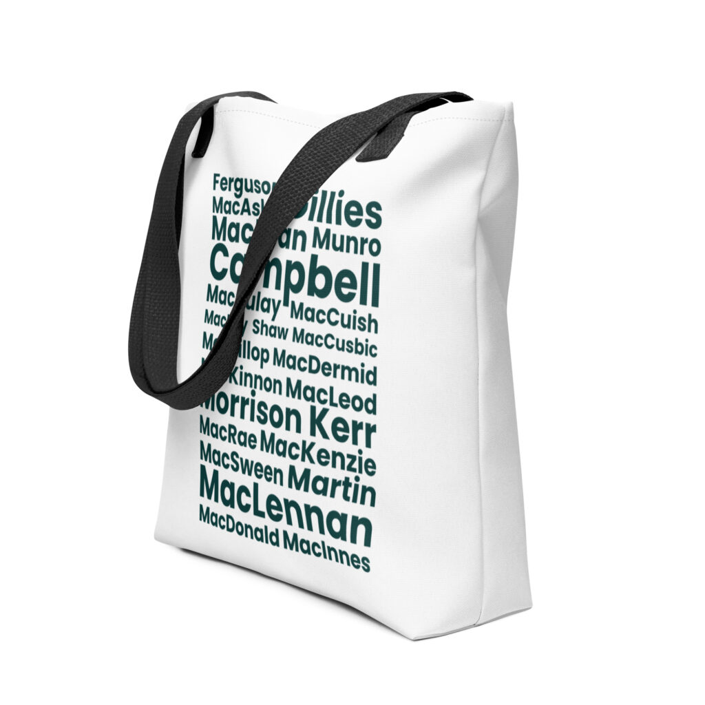 The Tote bag - All Names is a white tote bag with black handles. It features Scottish surnames such as Campbell, Kerr, and MacLennan printed in green text. The names appear in various sizes and angles across the surface of the bag.