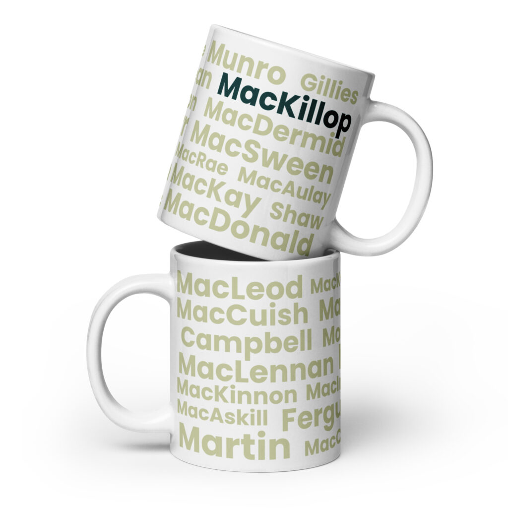 Certainly! Here is a revised, factual description: Two white mugs are stacked together. Each mug features various Scottish surnames, including MacKillop, MacDonald, MacLeod, and Campbell. The surnames are printed in different fonts. The Mug - MacKillop is a suitable choice for individuals with an interest in or connection to Scottish heritage.